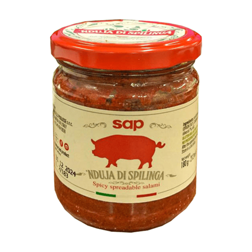 Jar of spicy spreadable salami with red lid on a white background