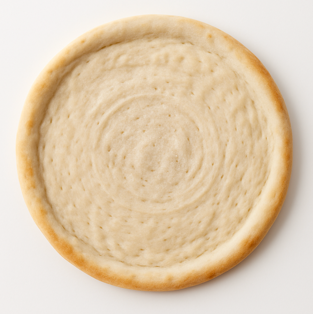 Round GF pizza dough on a white background