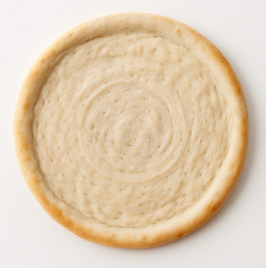 Round GF pizza dough on a white background